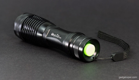 The MD50 torch featuring a bright green power button on the rear