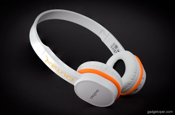 The Outlier bluetooth headphones fitted with the brightly coloured orange acoustic rings