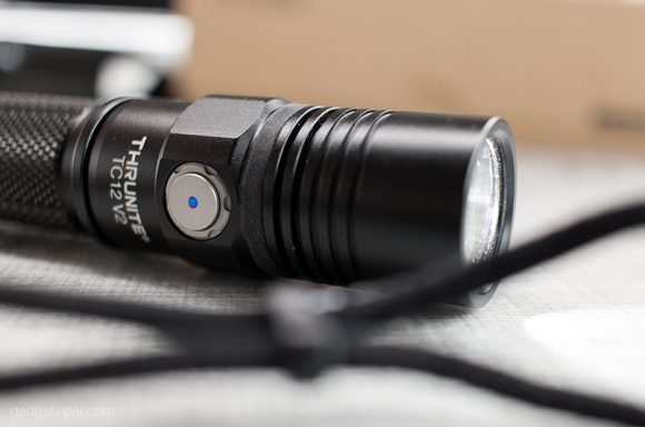 The side button on the ThruNite TC12-V2 flashlight
