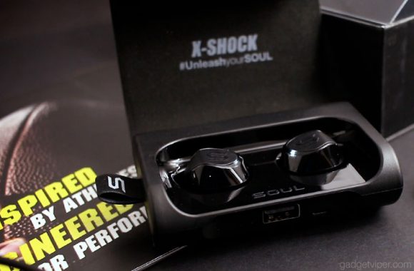 The X-Shock Bluetooth in-ear headphones in their charging station
